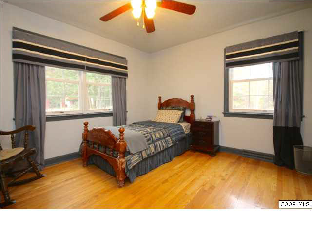8607 3 Notch Road Louisa, VA 23093 - Photo 18 of 26 a bedroom with a bed and window