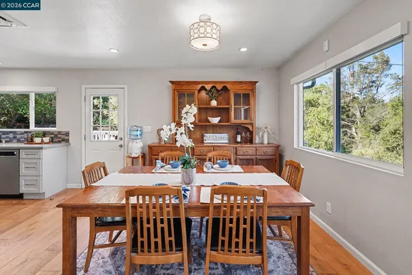 a view of a dining room with furniture window and outside view
