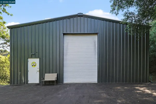 a view of outdoor space with wooden wall