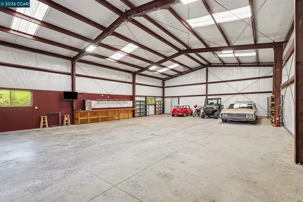 a view of parking garage with cars