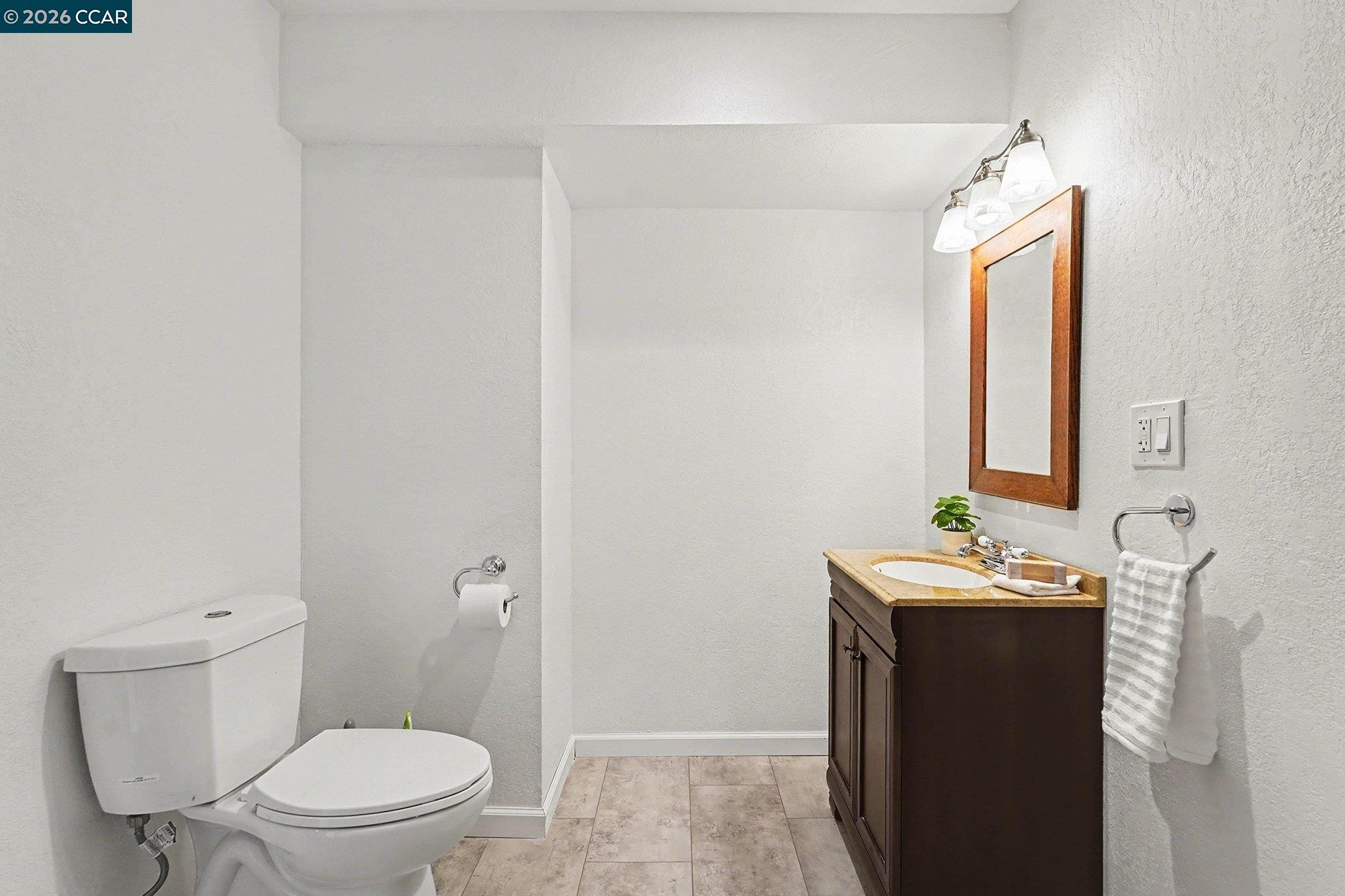 5745 Alhambra Valley Road Martinez, CA 94553 - Photo 30 of 47 a bathroom with a granite countertop sink toilet and shower