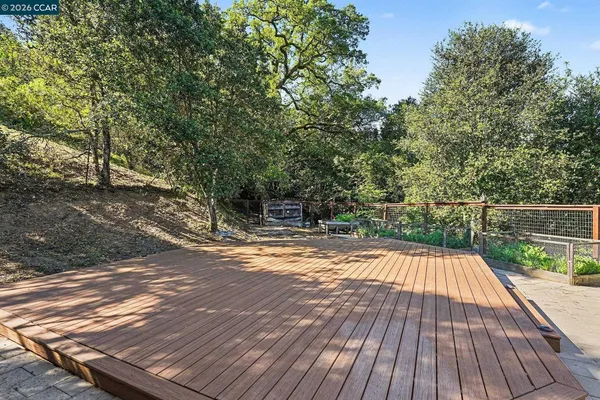 a view of balcony with wooden floor