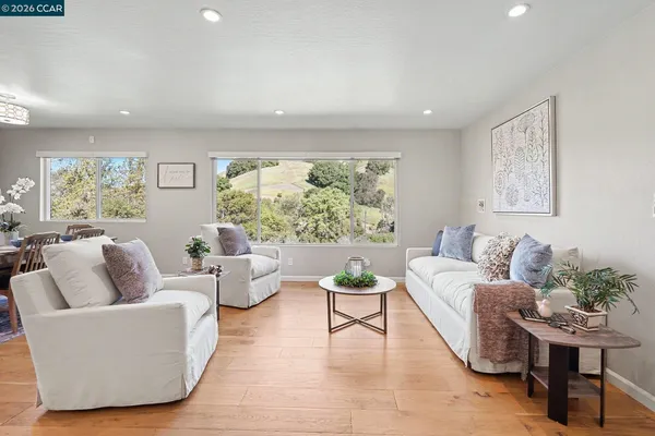 a living room with furniture and a large window