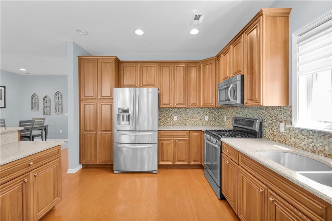 1011 Resolution Drive Bethlehem, PA 18017 - Photo 16 of 49 a kitchen with a refrigerator sink and cabinets
