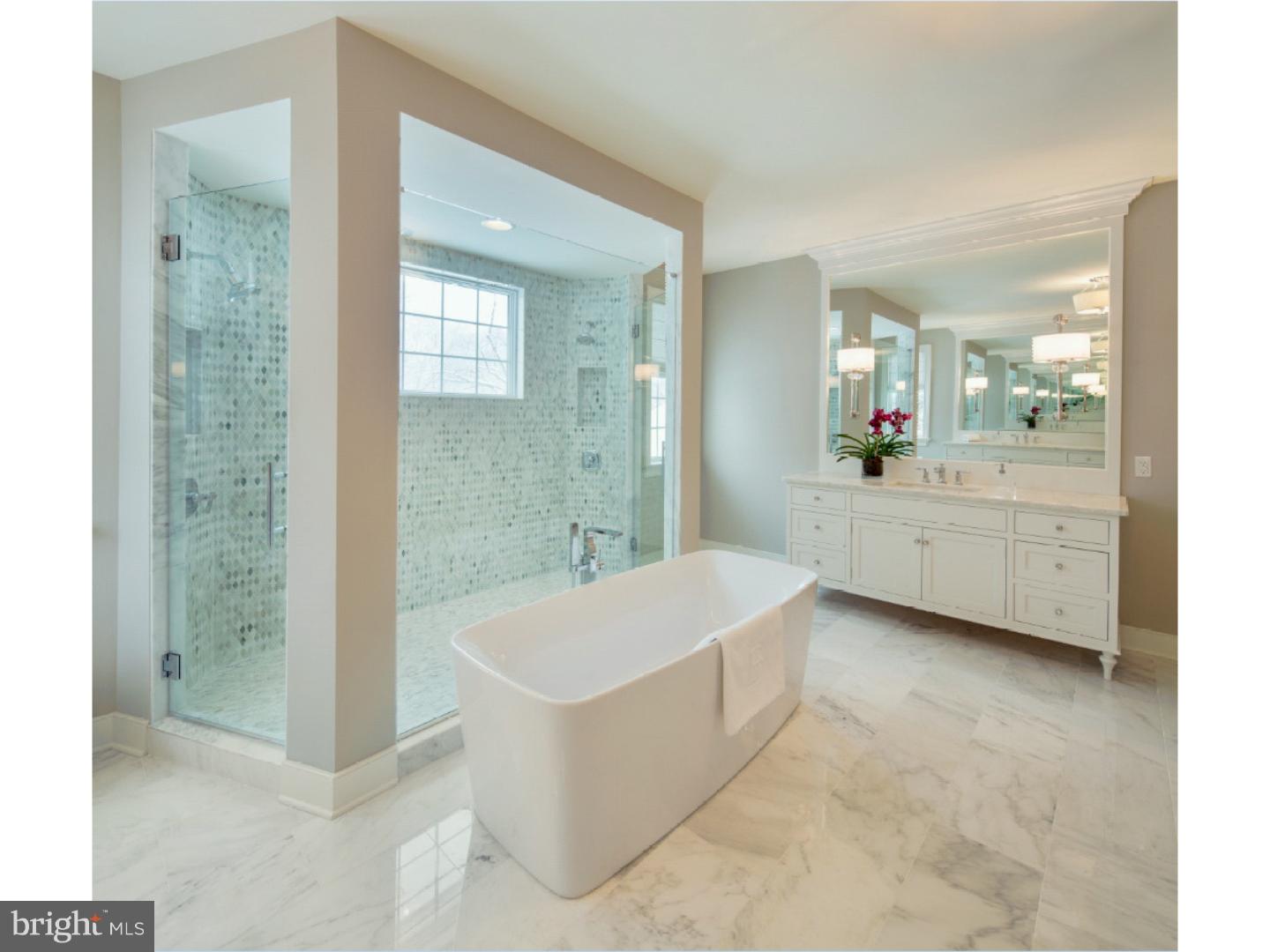 220 South Waterloo Road Devon, PA 19333 - Photo 11 of 13 a spacious bathroom with a tub sink and mirror