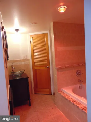 a bathroom with a bathtub and a shower
