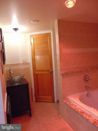 a bathroom with a bathtub and a sink