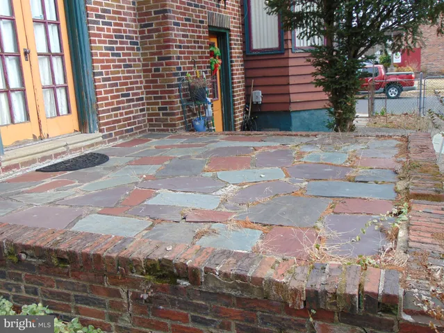 a view of a brick building with many windows