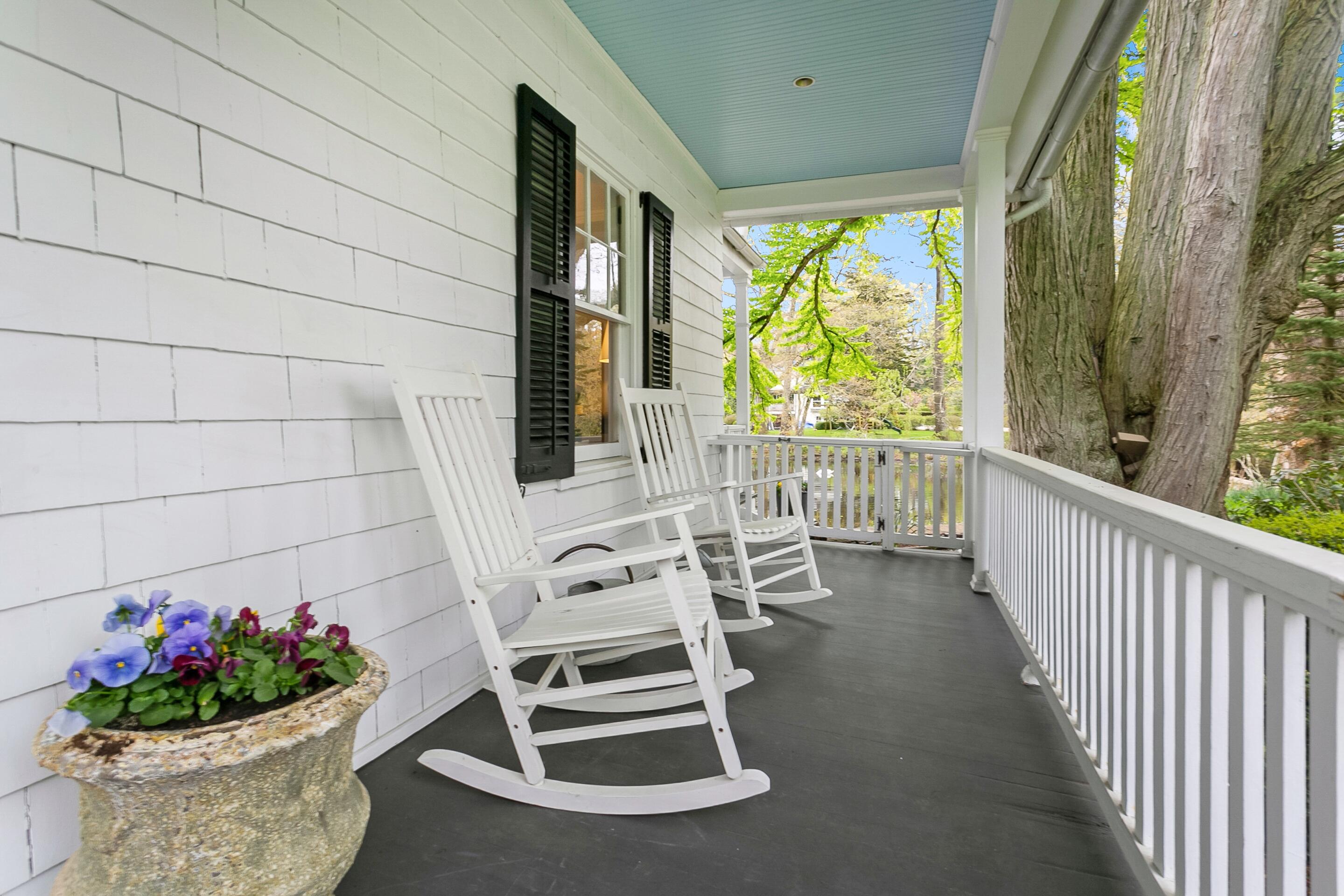 35 Old Farm Road Darien, CT 06820 - Photo 4 of 26 a view of a chairs and table in a balcony