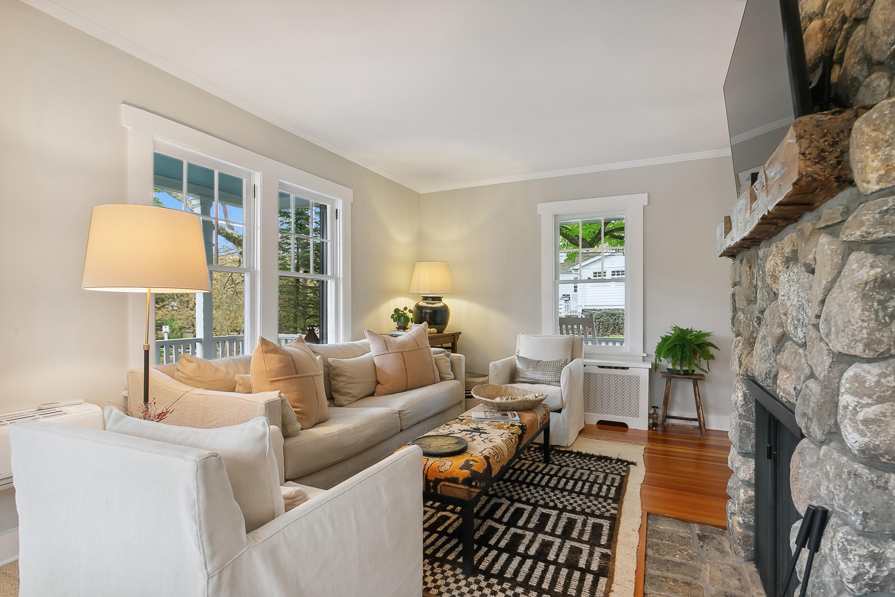 35 Old Farm Road Darien, CT 06820 - Photo 7 of 26 a living room with furniture and a fireplace