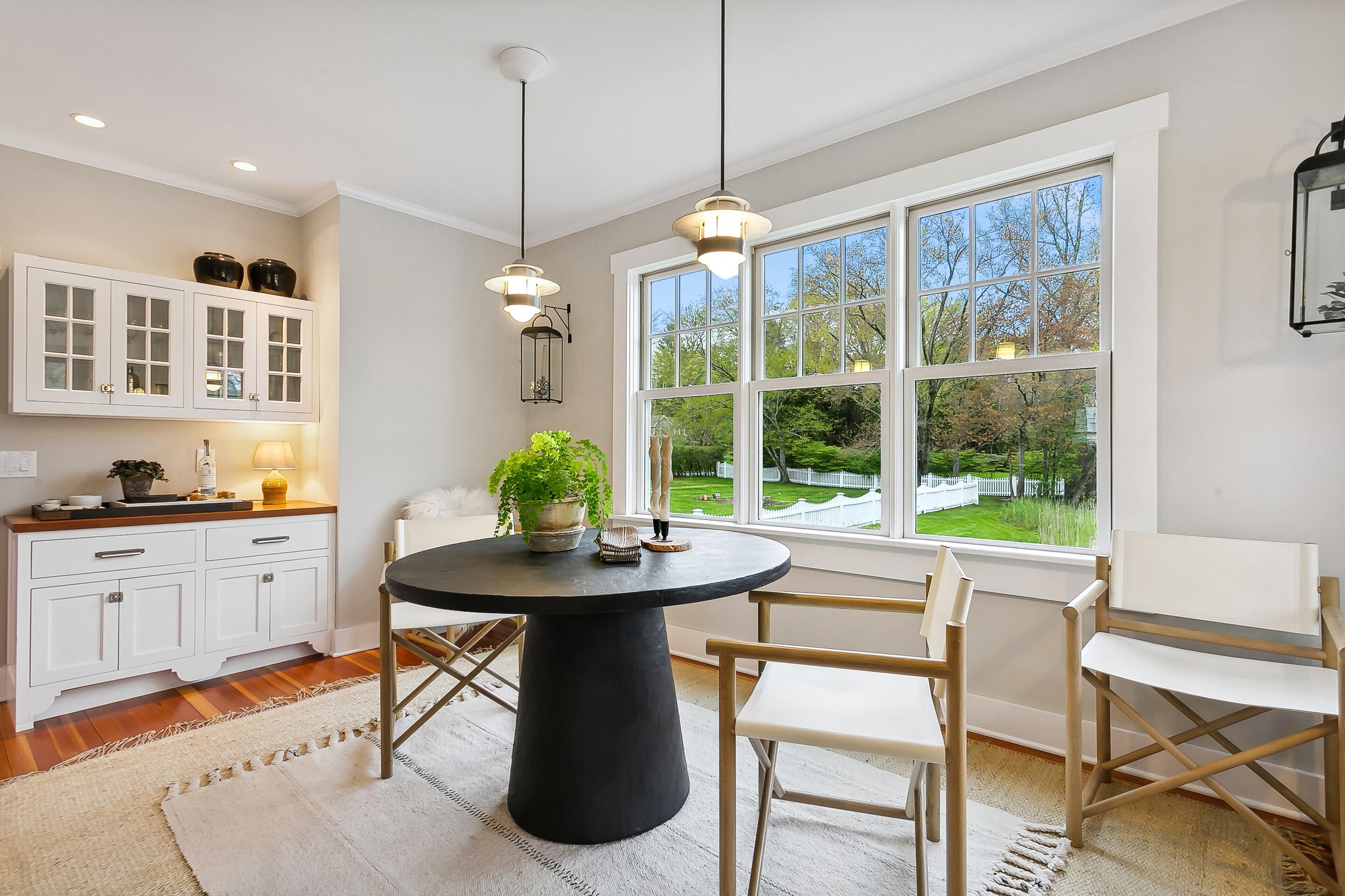 35 Old Farm Road Darien, CT 06820 - Photo 9 of 26 a dining room with furniture a chandelier and wooden floor