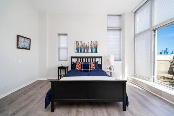 a bedroom with a bed and a window