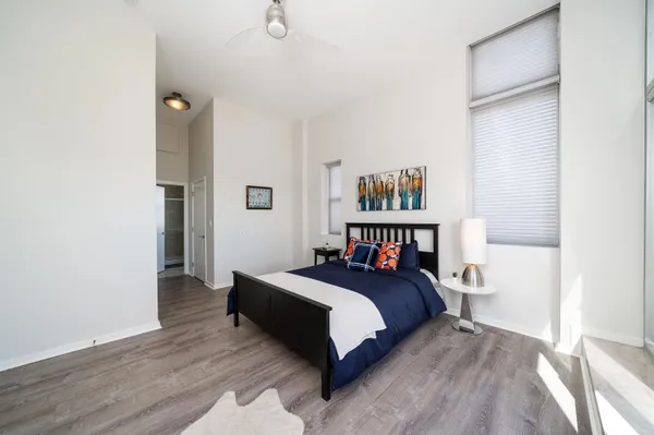 a bedroom with a bed and a book shelf