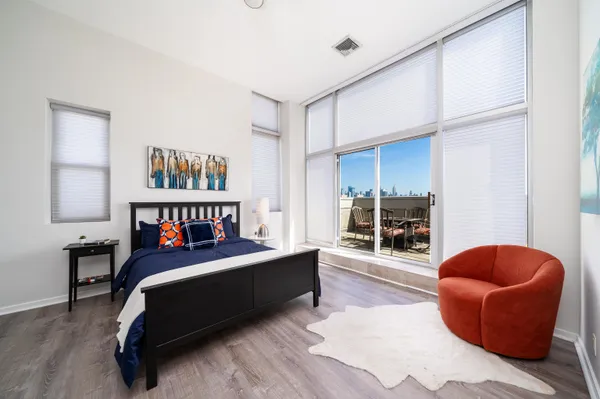 a bedroom with furniture and a book shelf