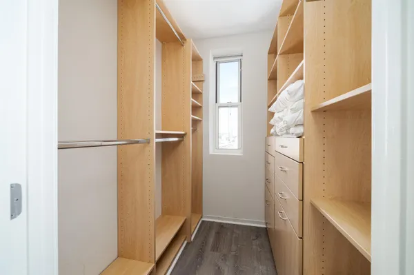a view of walk in closet with window