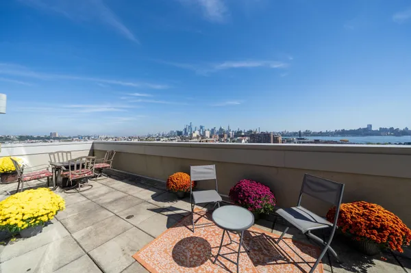 a view of a terrace with furniture and stove