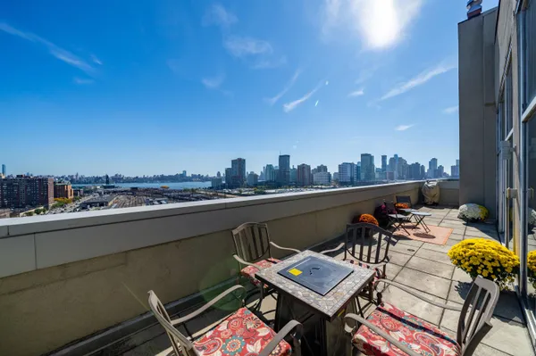 a view of a terrace with furniture
