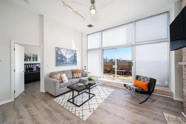 a living room with furniture and a large window