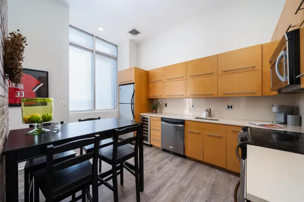 a kitchen with a sink cabinets and window