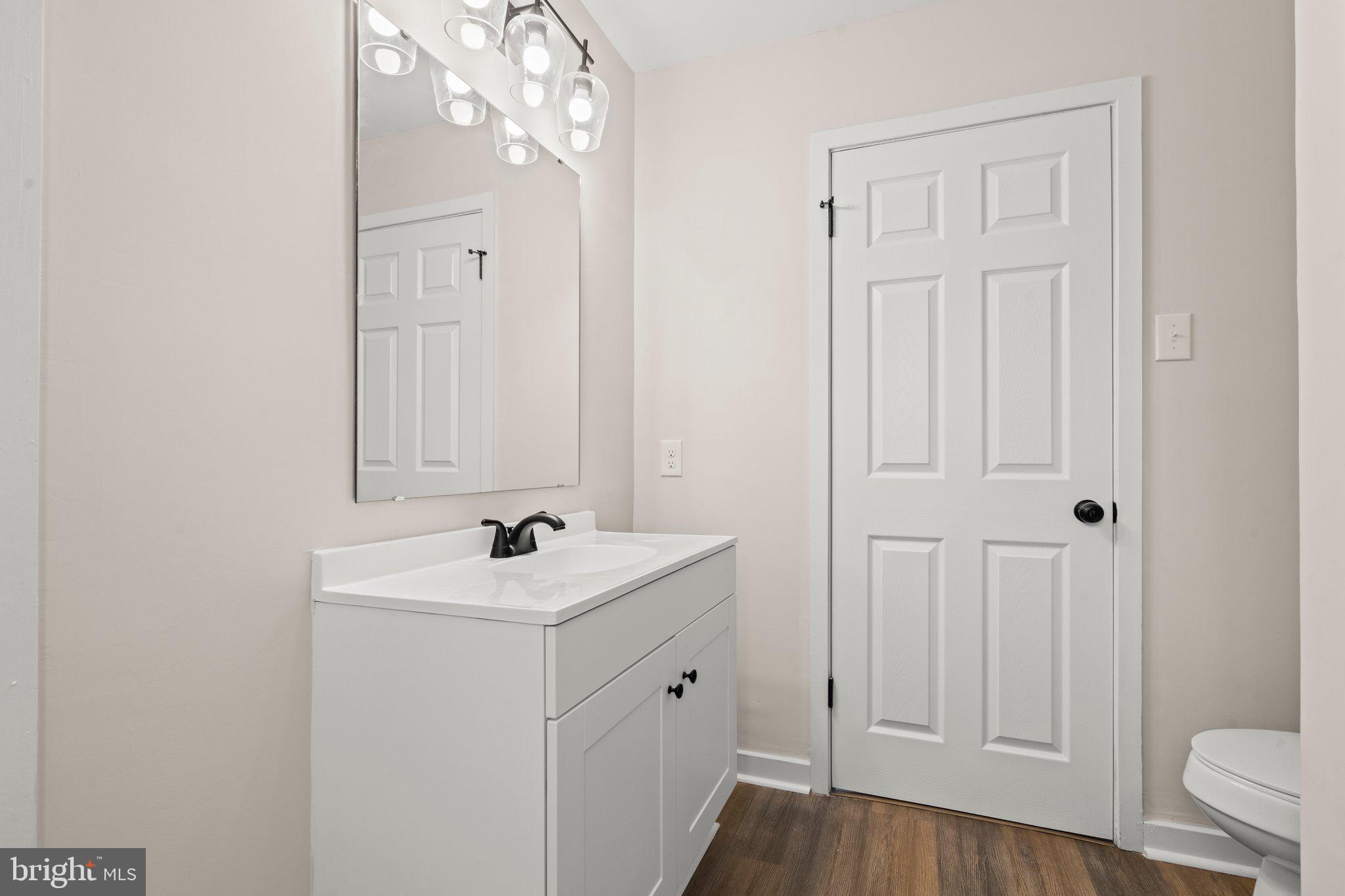 1210 Thackery Court Sicklerville, NJ 08081 - Photo 13 of 18 a bathroom with a sink toilet and vanity