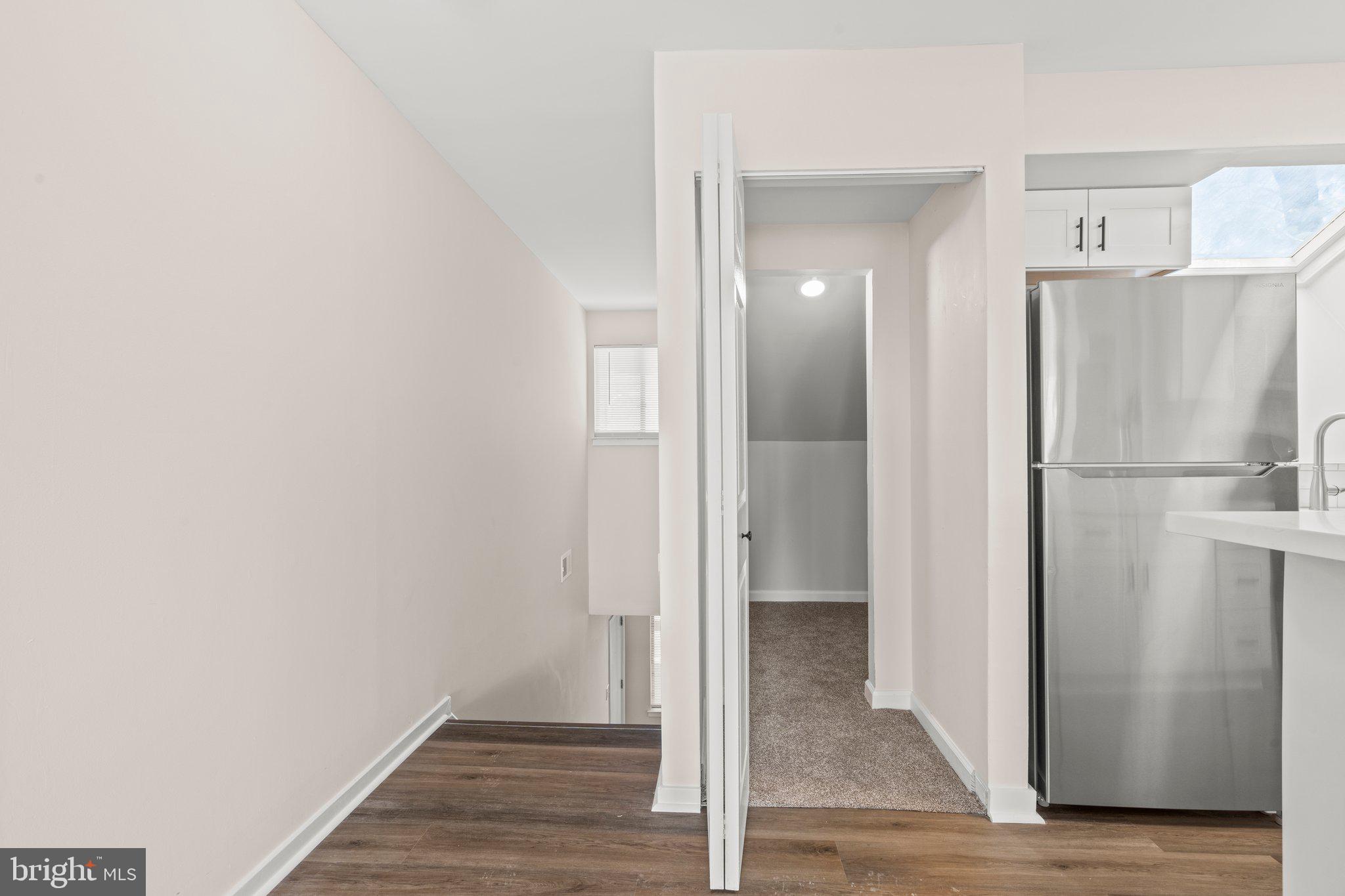 1210 Thackery Court Sicklerville, NJ 08081 - Photo 8 of 18 a view of a hallway with wooden floor and a hallway