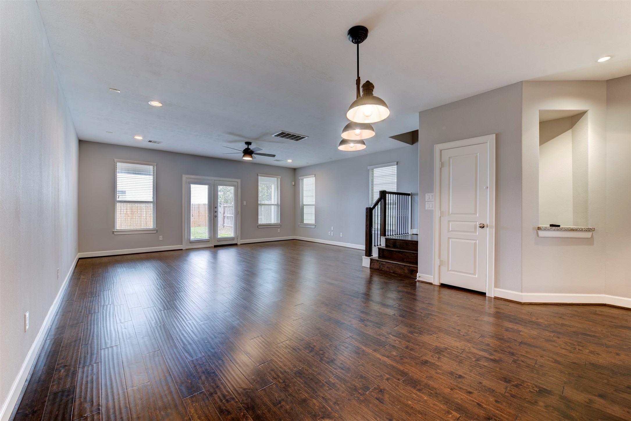 1811 Wichita Street, Unit A Houston, TX 77004 - Photo 10 of 36 a view of empty room with wooden floor and window