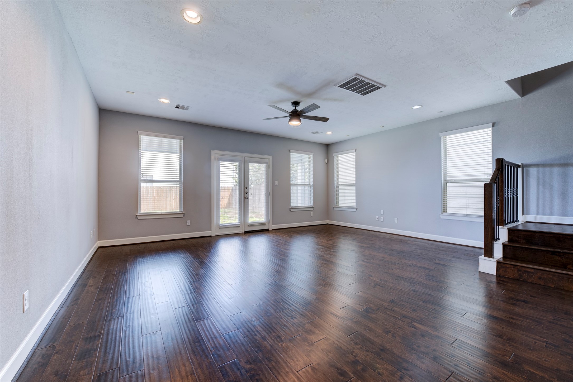 1811 Wichita Street, Unit A Houston, TX 77004 - Photo 13 of 36 a view of an empty room with wooden floor and a window
