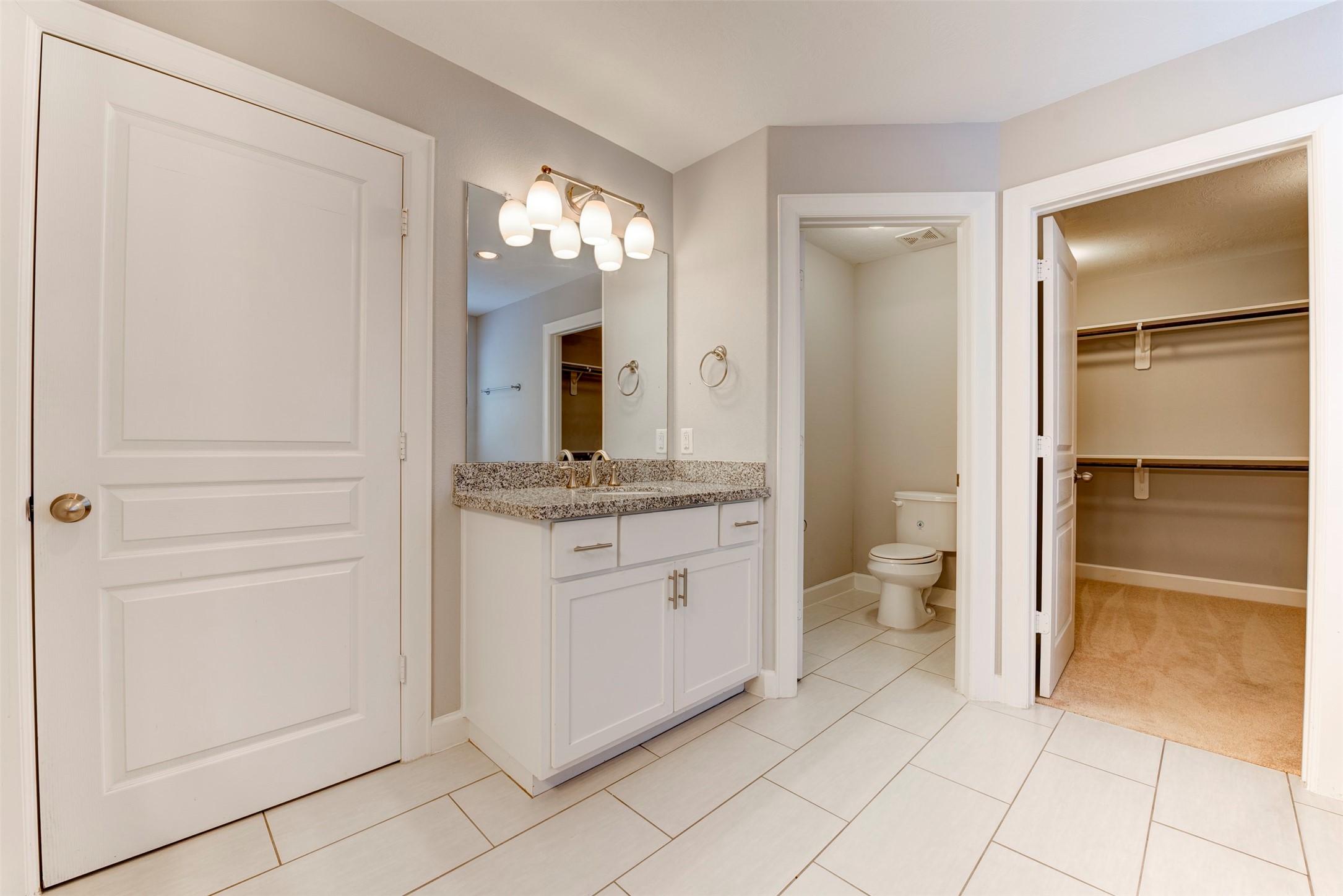 1811 Wichita Street, Unit A Houston, TX 77004 - Photo 21 of 36 a bathroom with a granite countertop sink mirror and toilet