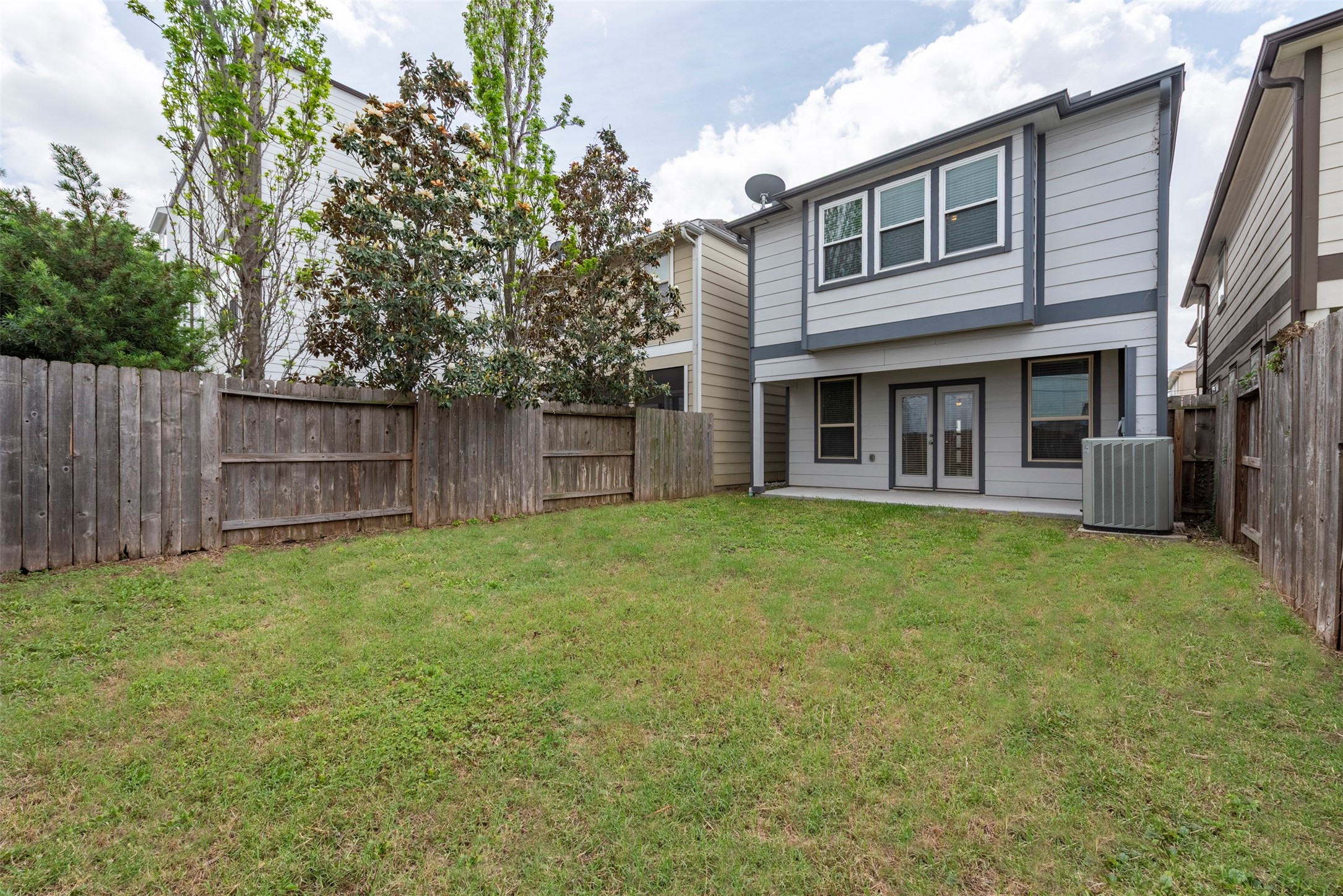 1811 Wichita Street, Unit A Houston, TX 77004 - Photo 29 of 36 a view of a house with a yard and a large tree
