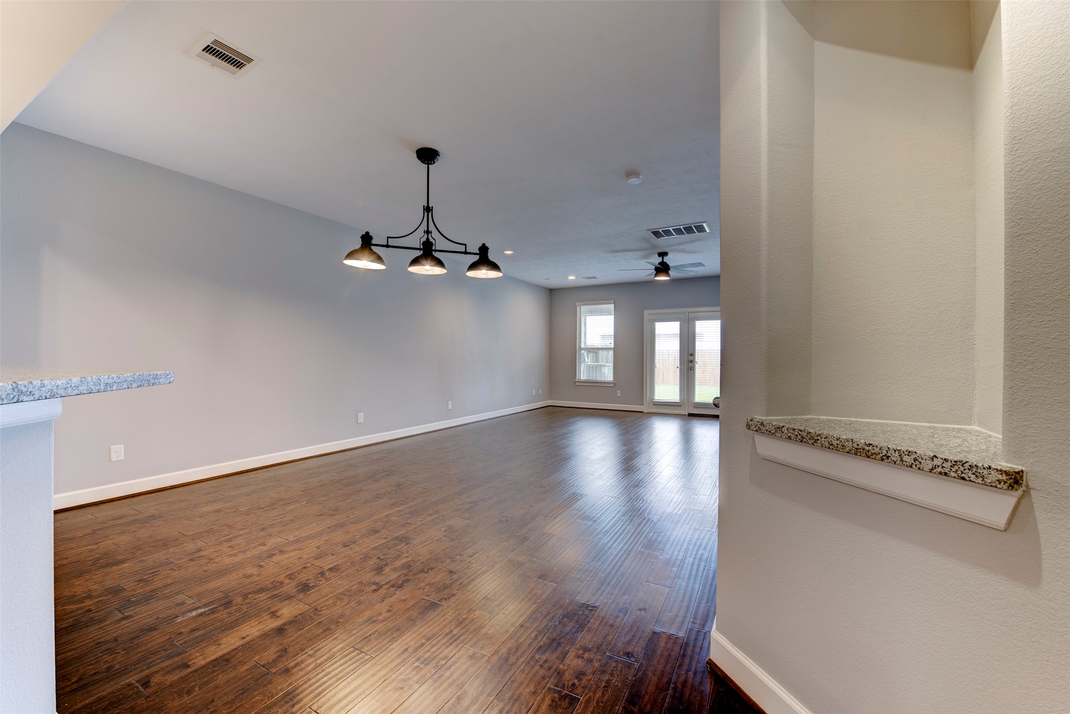 1811 Wichita Street, Unit A Houston, TX 77004 - Photo 4 of 36 wooden floor in an empty room with a window