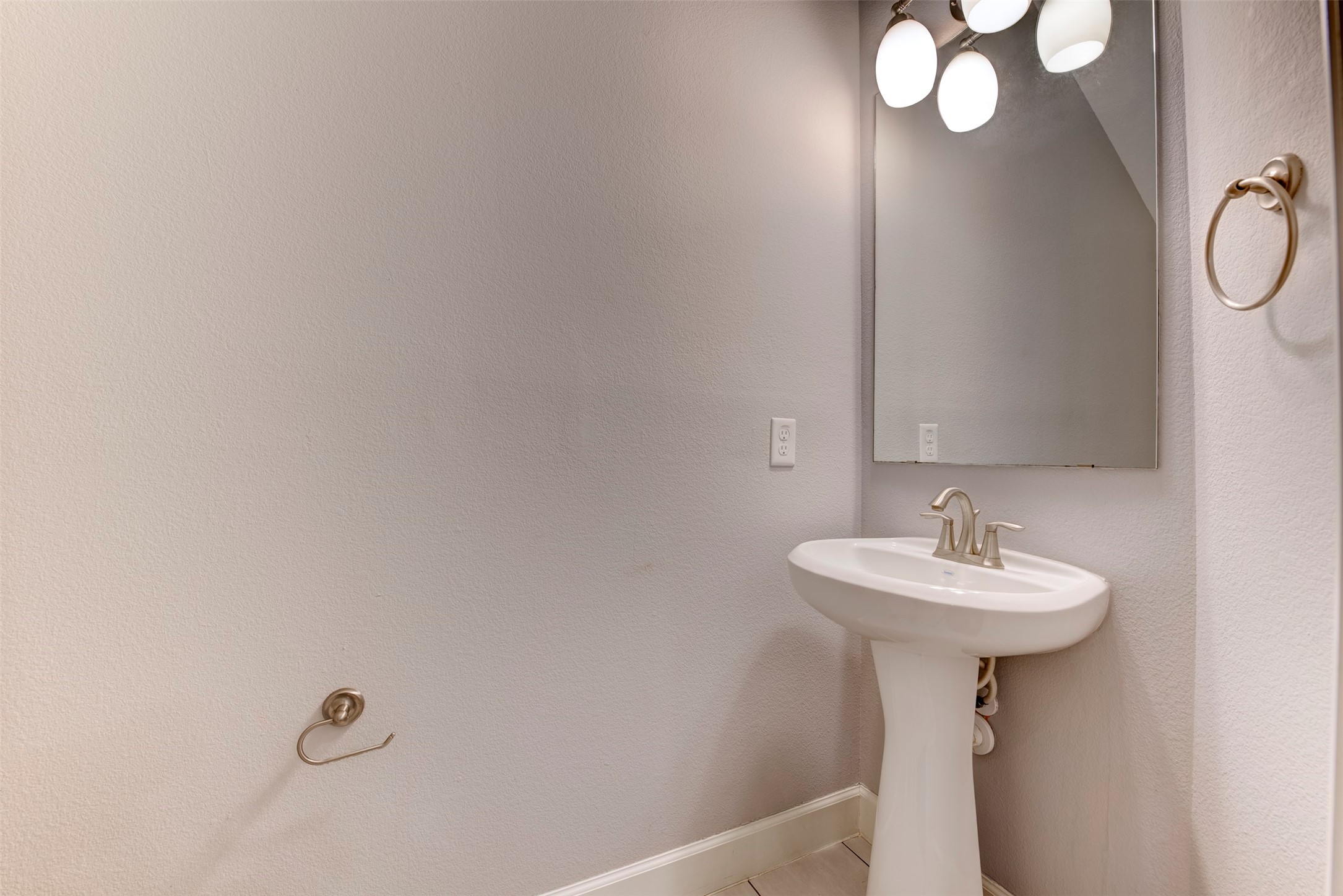 1811 Wichita Street, Unit A Houston, TX 77004 - Photo 9 of 36 a bathroom with a sink a mirror and a shower