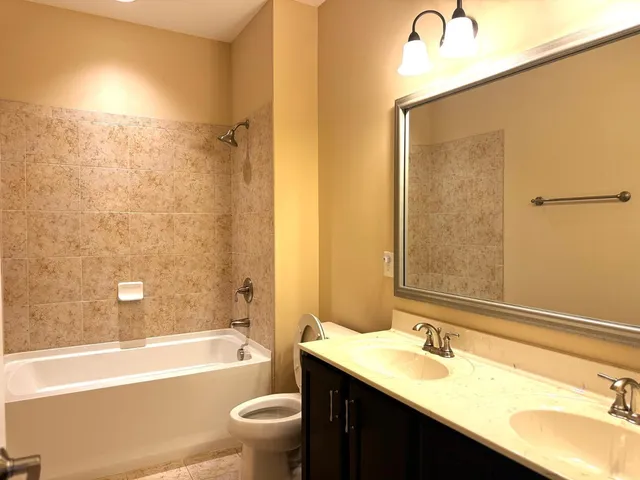 a view of a hallway with wooden shelves