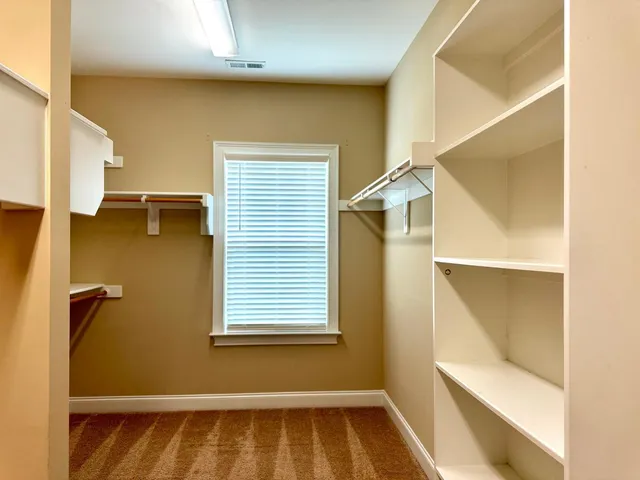 a bathroom with a bathtub sink and mirror