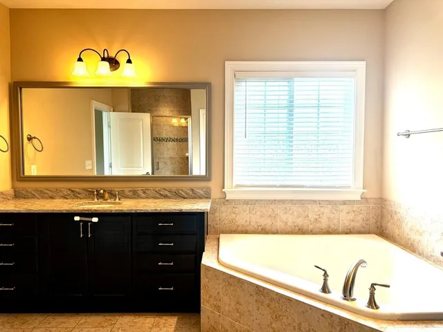 a bathroom with a glass shower door