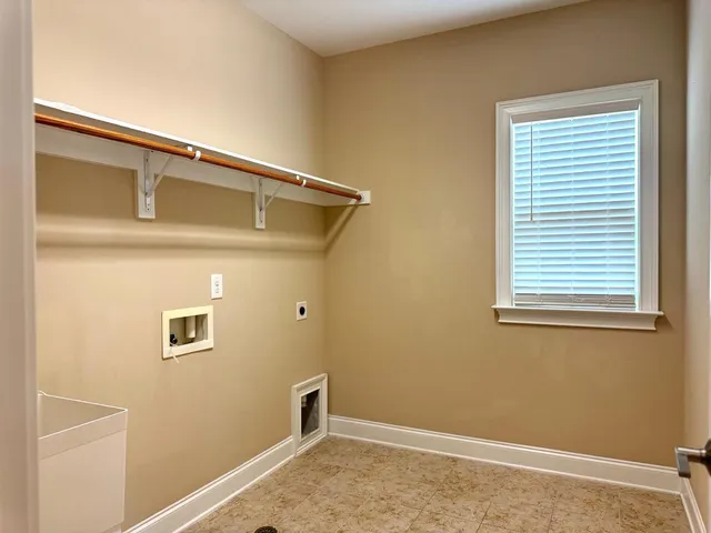 a view of a park with iron fence