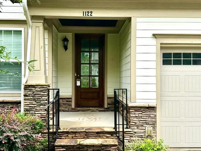a front view of a house with a porch