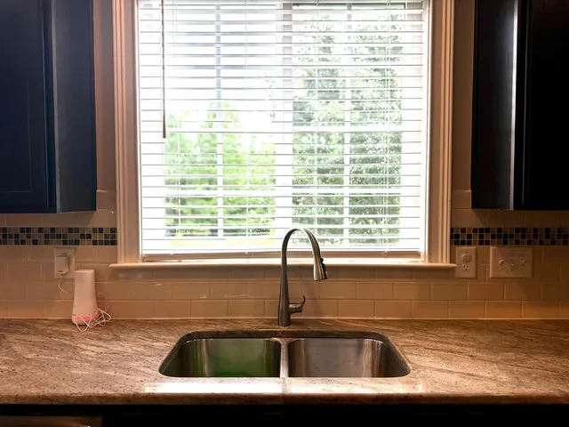 a kitchen with a sink and a window