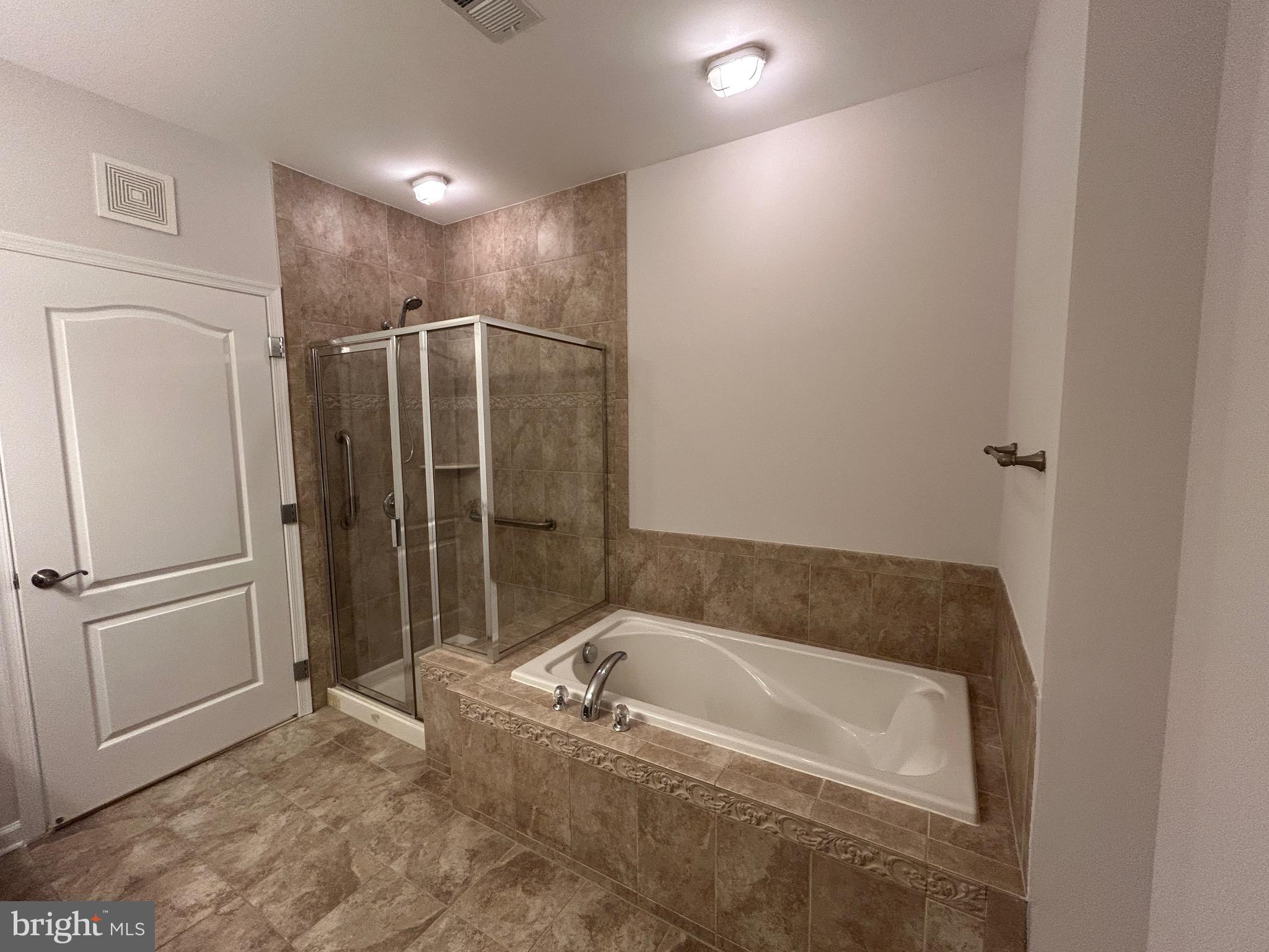 1406 Wigeon Way, Unit 306 Gambrills, MD 21054 - Photo 17 of 32 Primary Bathroom Tub and Shower