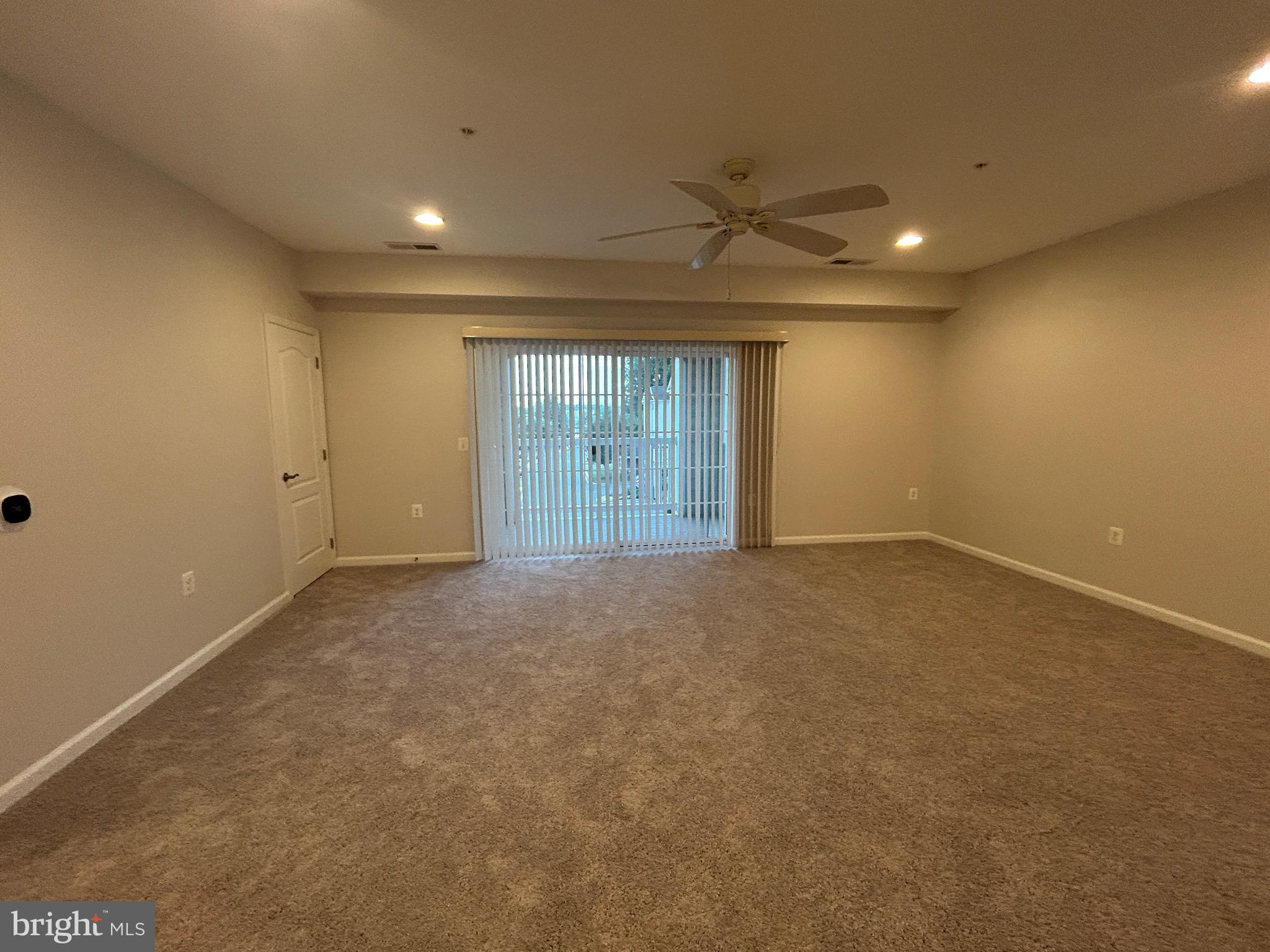 1406 Wigeon Way, Unit 306 Gambrills, MD 21054 - Photo 4 of 32 Living Room with Balcony Access