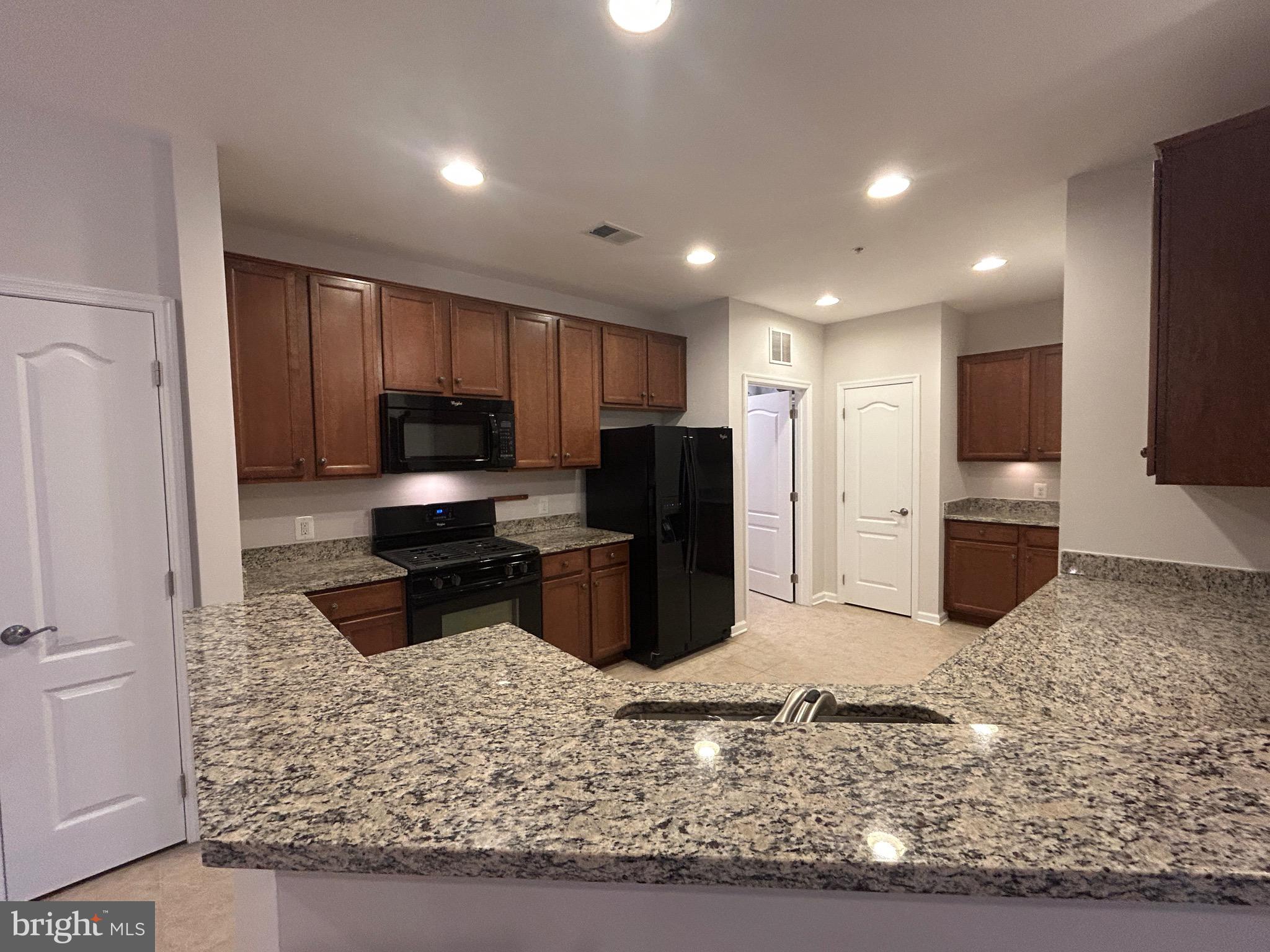 1406 Wigeon Way, Unit 306 Gambrills, MD 21054 - Photo 7 of 32 Gleaming Granite Countertops
