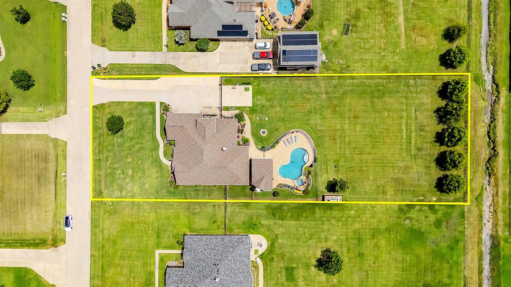 12286 Emerald Ranch Lane North Forney, TX 75126 - Photo 38 of 40 an aerial view of a swimming pool with a yard