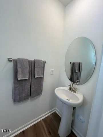 a bathroom with a sink and mirror