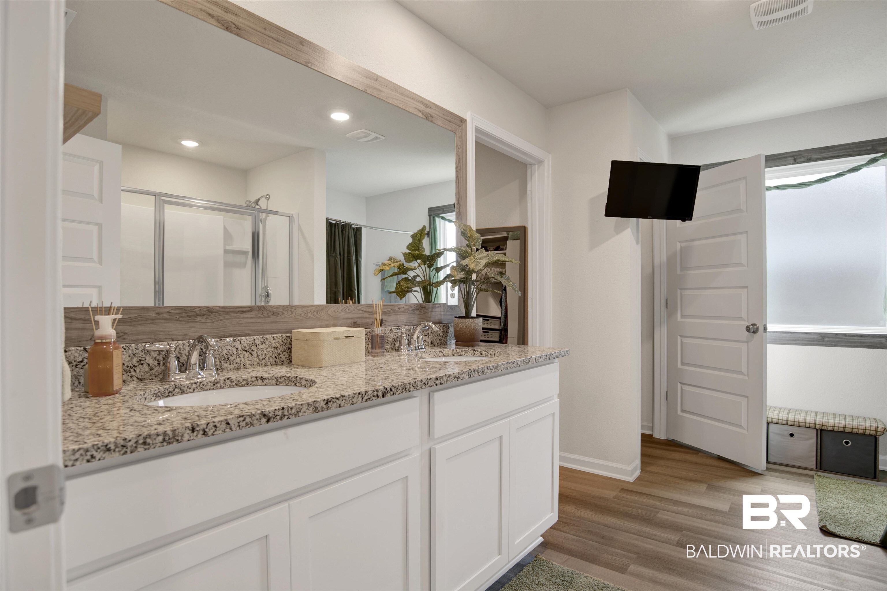 22301 Early Dawn Circle Foley, AL 36535 - Photo 13 of 45 Double vanity with stone-finish countertop and undermount sinks