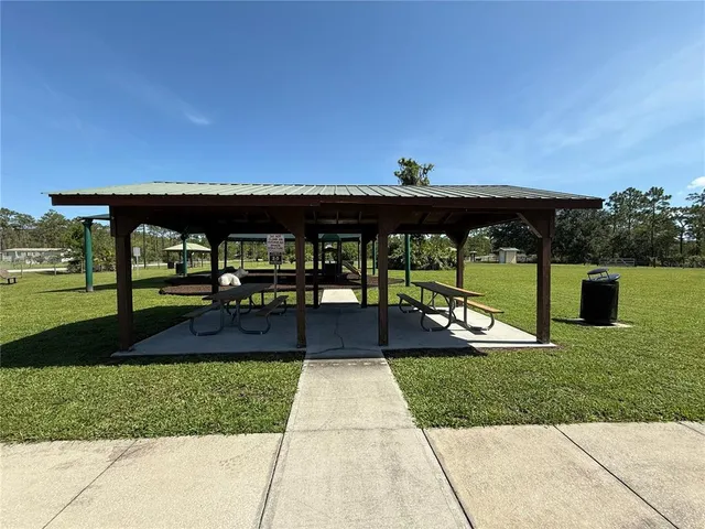 a view of swimming pool with seating space
