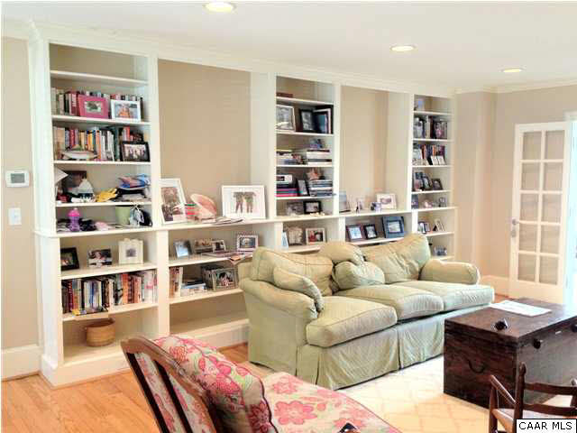 2115 Minor Road Charlottesville, VA 22903 - Photo 5 of 30 a living room with furniture a book shelf and a bookshelf
