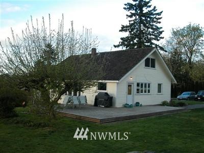 7228 Skipley Road Snohomish, WA 98290 - Photo 1 of 1 a front view of a house with a garden