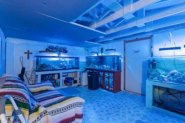 a view of a livingroom with furniture and chandelier