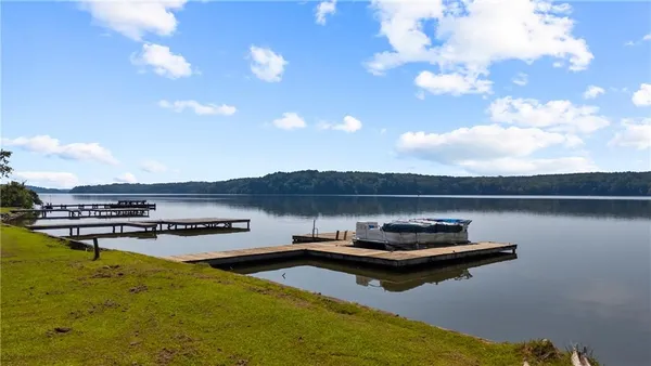 a view of a lake with outdoor seating