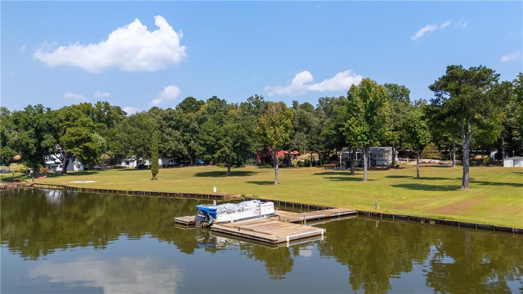 1631 Arrowhead Road Greensboro, GA 30642 - Photo 2 of 83 a view of a lake with a nearby beach