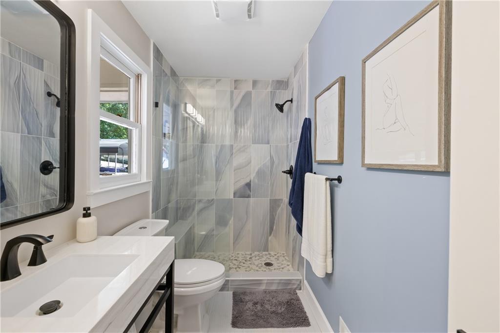 1631 Arrowhead Road Greensboro, GA 30642 - Photo 22 of 83 a bathroom with a sink toilet and shower